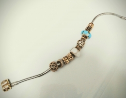 Gold charms with Gold and Silver Bracelet