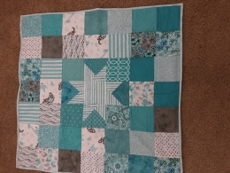 Baby quilt and matching bib
